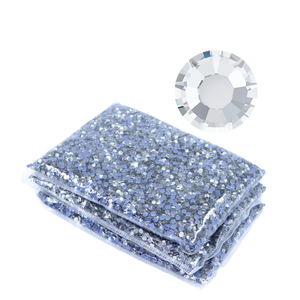 Wholesale packaging of crystal clear rhinestones with a close-up of a single rhinestone on a white background.